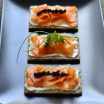 Carrot salmon, vegan cream cheese and caviar made from algae on swedish crispbread